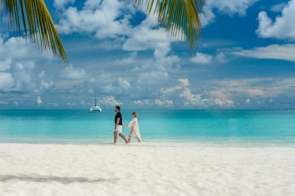 Couple walking on a tropical beach